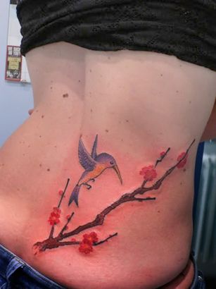 Hummingbird And Cherry Blossom Branch Tattoo On Lower Back